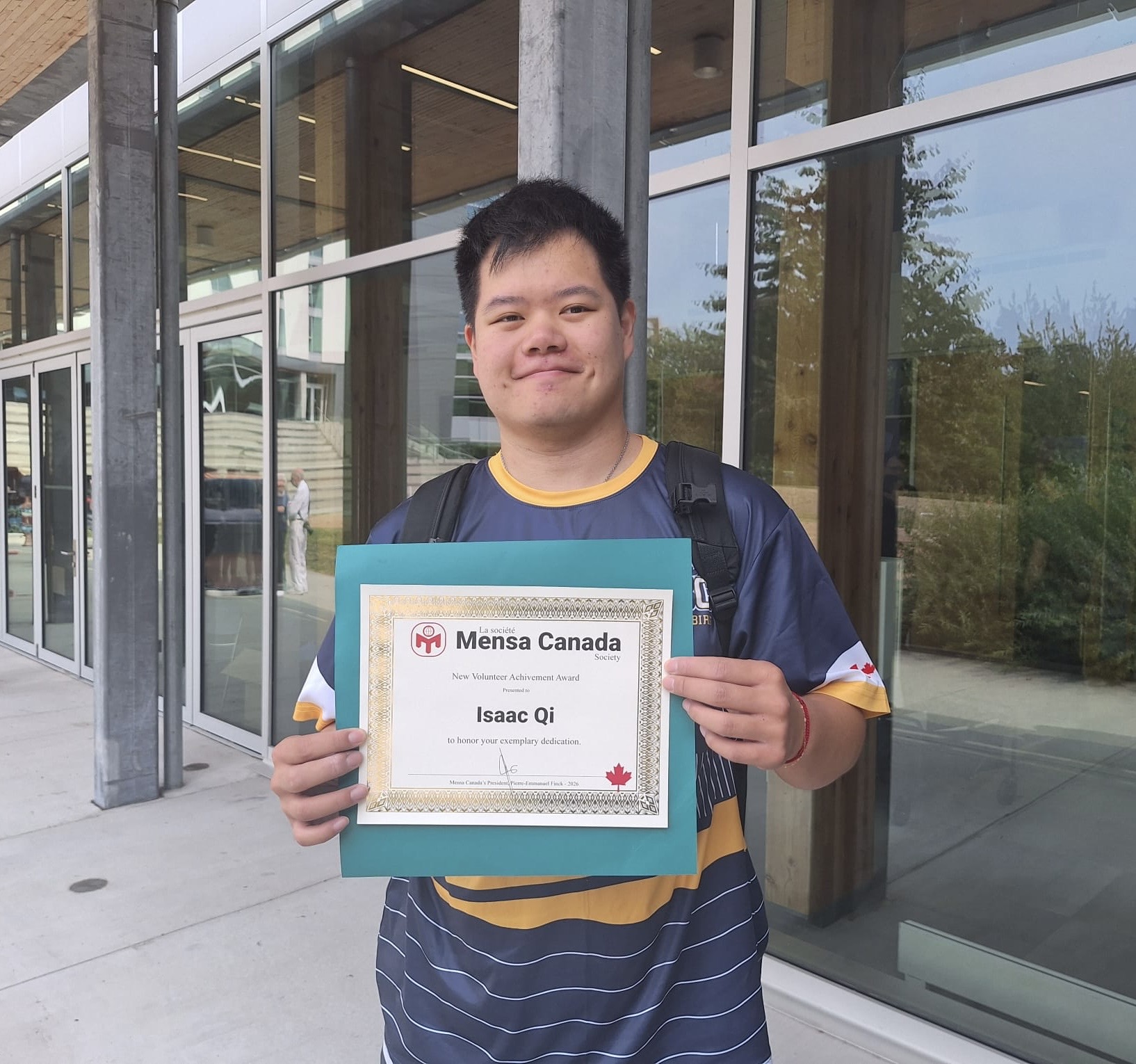 Isaac Qi receiving the Mensa Canada New Volunteer Achievement Award, 2026